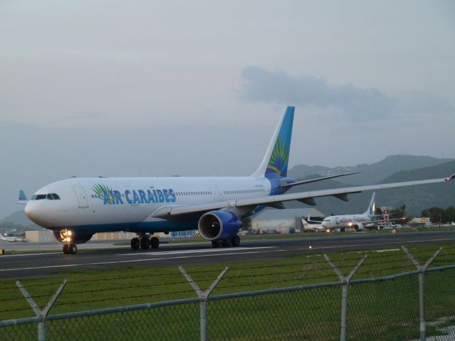 Airbus A330-200 (F-OFDF) - Air Caraibes A332 departing; Caribbean Airlines B738 arriving.