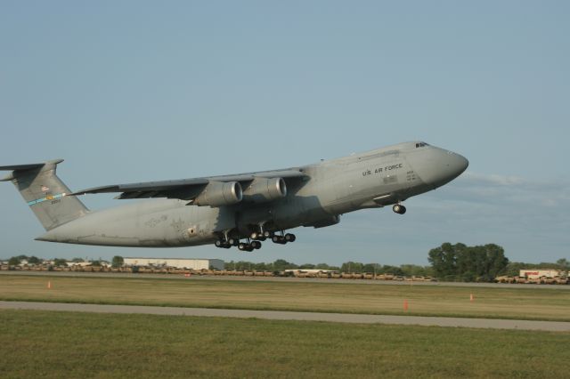 — — - C5-B Departs Oshkosh EAA 2009