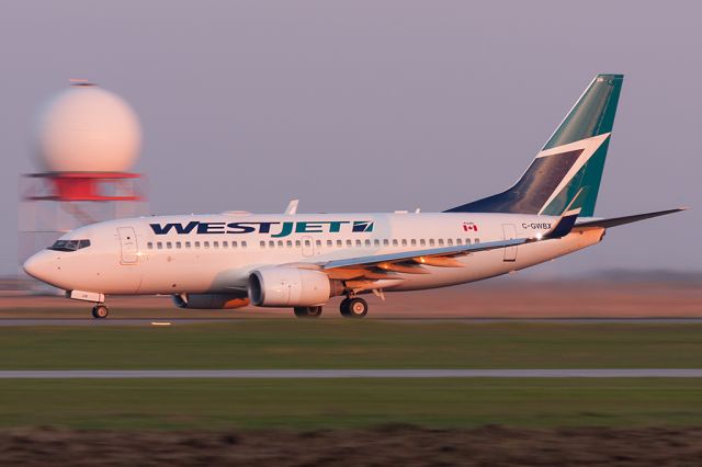 Boeing 737-700 (C-GWBX) - Taking Off Runway 18 In The Early Morning Light. [Canon 40D + 100-400mm]