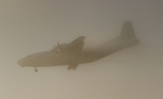 Antonov An-12 (UR-CKM) - Just visible through thick fog is this Cavok Air An12BP bringing parts in from Huntsville