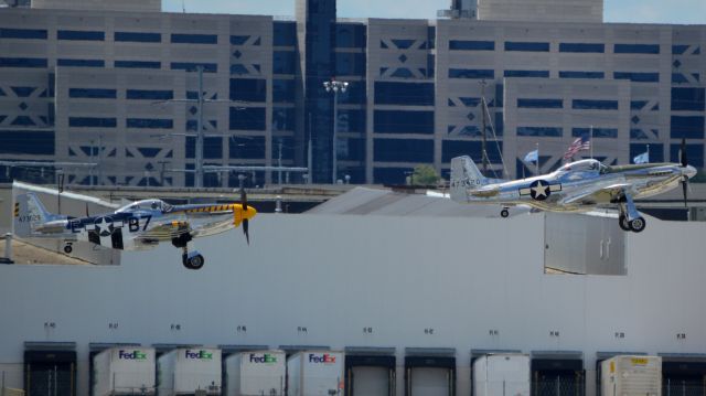 North American P-51 Mustang (N151AM) - Two P-51s taking off from CMH in formation.