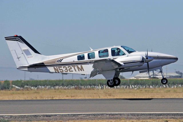 Beechcraft Baron (58) (N532TM) - Departing Merced Regional Airport (KMCE) heading for Pago Pago Intl Airport (NSTU)