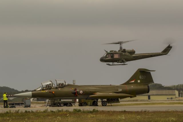 Canadair CL-201 Starfighter (LN-STF) - The only flying Canadair CF104D in Europe. Pilot Eskild Amdal in the CF104. Pilot Stig Bakke in the Bell UH1B LN-OUS which is also private owned and stationed only a cuple of miles from where i live here on the Norwegian west coast