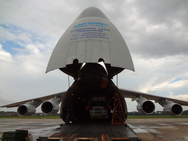 Antonov An-12 — - Loading some trailers inside the big bird