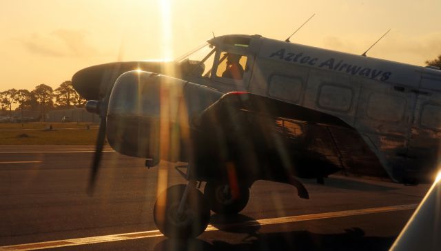 Beechcraft 18 (N9690R) - 1960 BEECH G18S early morning departure.