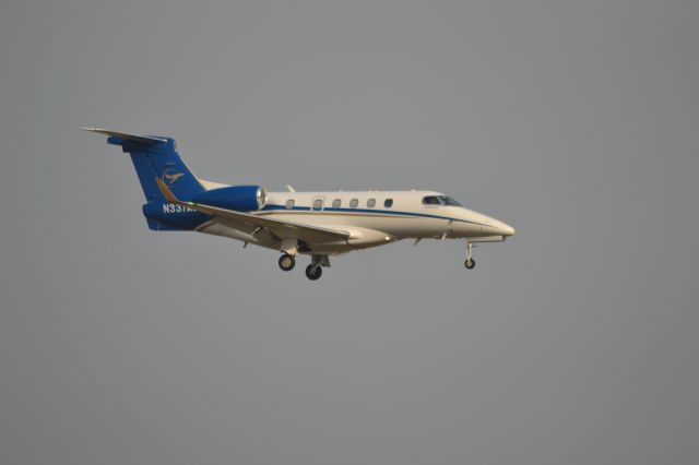 Embraer Phenom 300 (N337AS) - N337AS making a late afternoon landing on Runway 21 in Sioux Falls SD