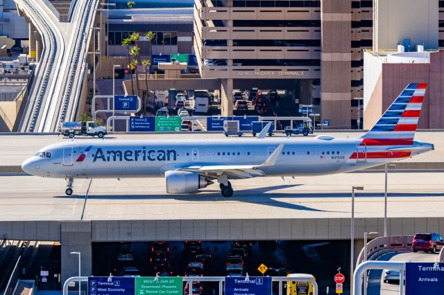 Airbus A321neo (N415AN) - An American Airlines A321 neo taxiing at PHX on 2/9/23 during the Super Bowl rush. Taken with a Canon R7 and Tamron 70-200 G2 lens.