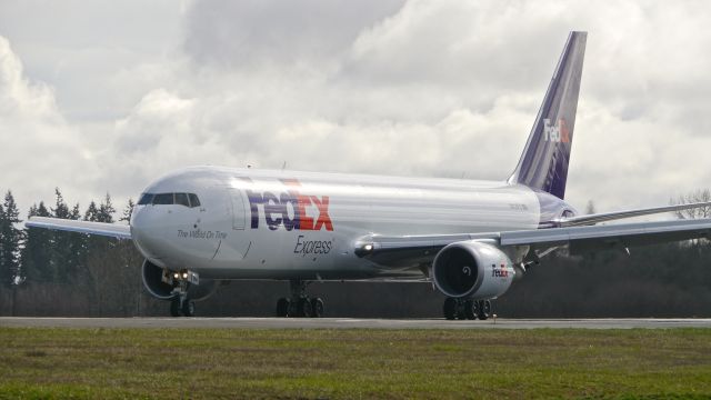 BOEING 767-300 (N114FE) - BOE567 lining up to depart Rwy 34L on its B1 flight on 2/14/15. (ln 1077 / cn 42712).