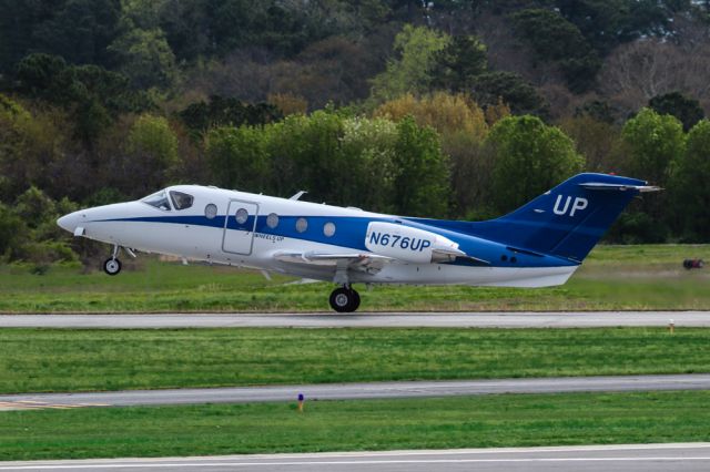 Beechcraft Beechjet (N676UP) - N676UP is a 2008 Hawker 400A seen here departing Atlanta's PDK executive airport. I shot this with a Canon 200-400mm F4 lens at the focal length of 280mm. Camera settings were 1/2500 shutter, F5.6, ISO 400. Please check out my other aviation photography. Votes and positive comments are greatly appreciated. Inquiries about prints or licensing of this photo can be sent to Info@Flews.com