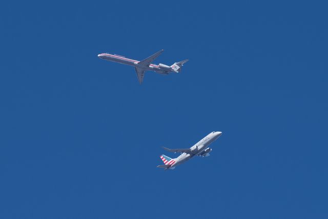 — — - American MD-83 on downwind for DFW while an Envoy ERJ175 climbs out.