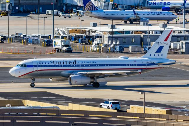 Airbus A320 (N475UA) - A United Airlines A320 in Friend Ship retro livery taxiing at PHX on 2/11/23 during the Super Bowl rush. Taken with a Canon R7 and Canon EF 100-400 II L lens.