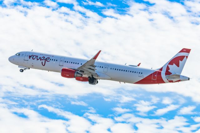 Airbus A321 (C-FJQL) - An Air Canada Rouge A321 taking off from PHX on 2/11/23 during the Super Bowl rush. Taken with a Canon R7 and Canon EF 100-400 II L lens.