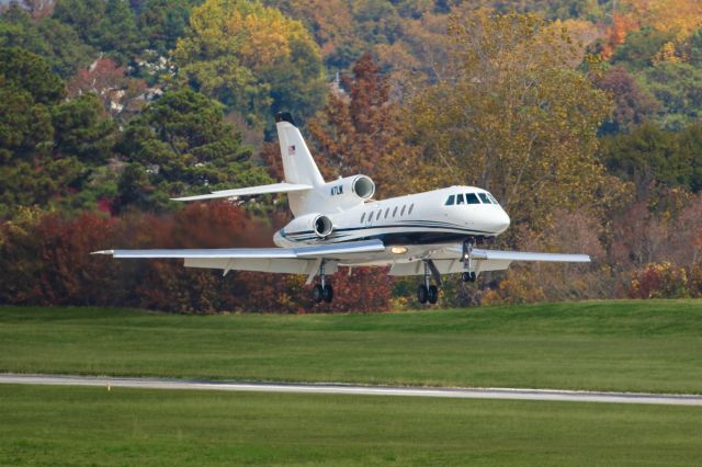 Dassault Falcon 50 (N7LW) - N7LW is a Dassault Falcon 50 seen here about to touchdown at Atlanta's PDK executive airport. This private jet is owned by the Living Word Church. I shot this with a Canon 500mm lens. Camera settings were 1/4000 shutter, F4, ISO 250.  Please check out my other photography. Votes and positive comments are always appreciated. Questions about this photo can be sent to Info@FlewShots.com