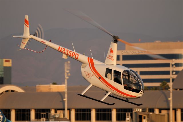 Robinson R-44 (N335PD) - R44 Raven II taking off from JWA.
