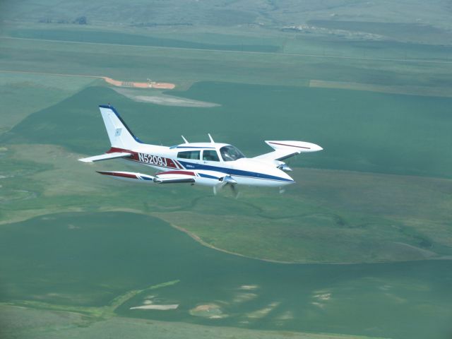 Cessna 310 (N5209J) - Coming home to Montana with new paint from Vanco Aviation in Hazen ND.  New interior from Exec Air in Bismarck ND.  They are the BEST!!