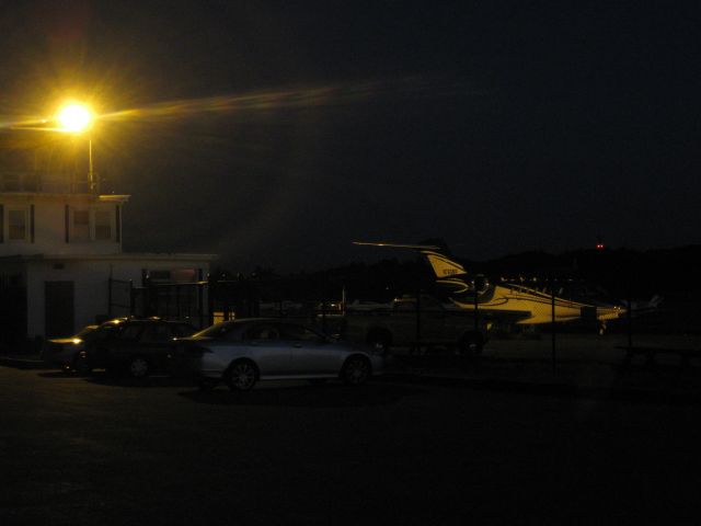 — — - Fitchburg Municipal Airport at night. The Citation X is N760BP.