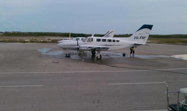 Piper Apache (VQ-TRF) - CAICOS EXPRESS CESSNA 402S GETING A WASH DOWN.