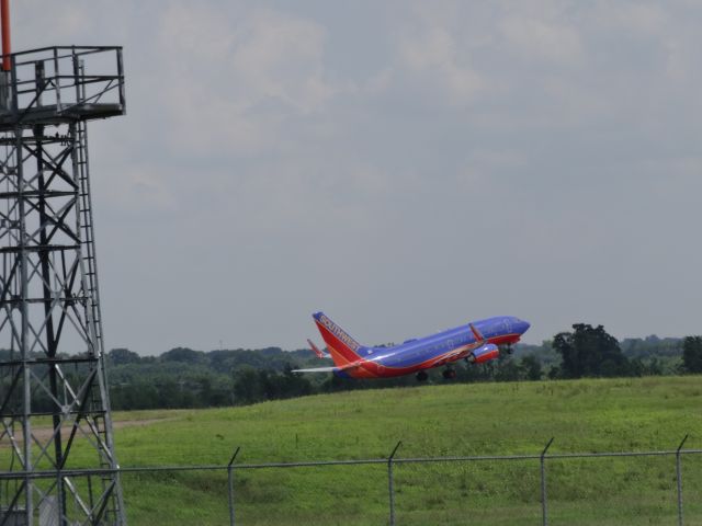 Boeing 737-700 (N435WN) - Standing just south of runway 02C, I was able to capture several aircraft on take-off