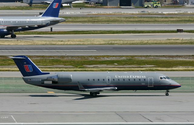 Canadair Regional Jet CRJ-200 (N956SW) - KSFO - United Express on taxi to Runway 1LR departure runways.br /br /Serial number 7825br /Type CRJ-200ERbr /First flight date Unknownbr /Test registration C-FMKWbr /Plane age 13 years