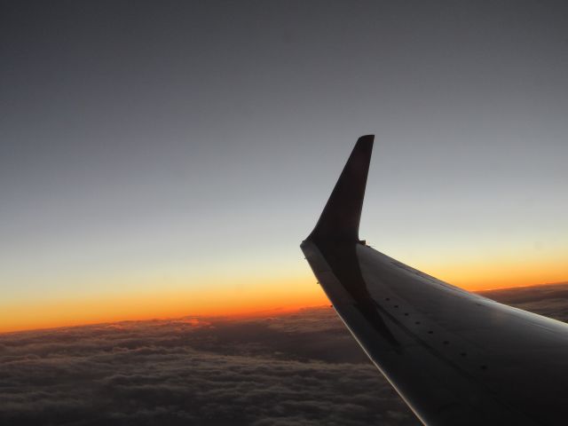 Boeing 737-700 (N214WN) - Flying on Maryland One from KSEA-KDEN, as we begin our descent into Denver with a beautiful sunset.