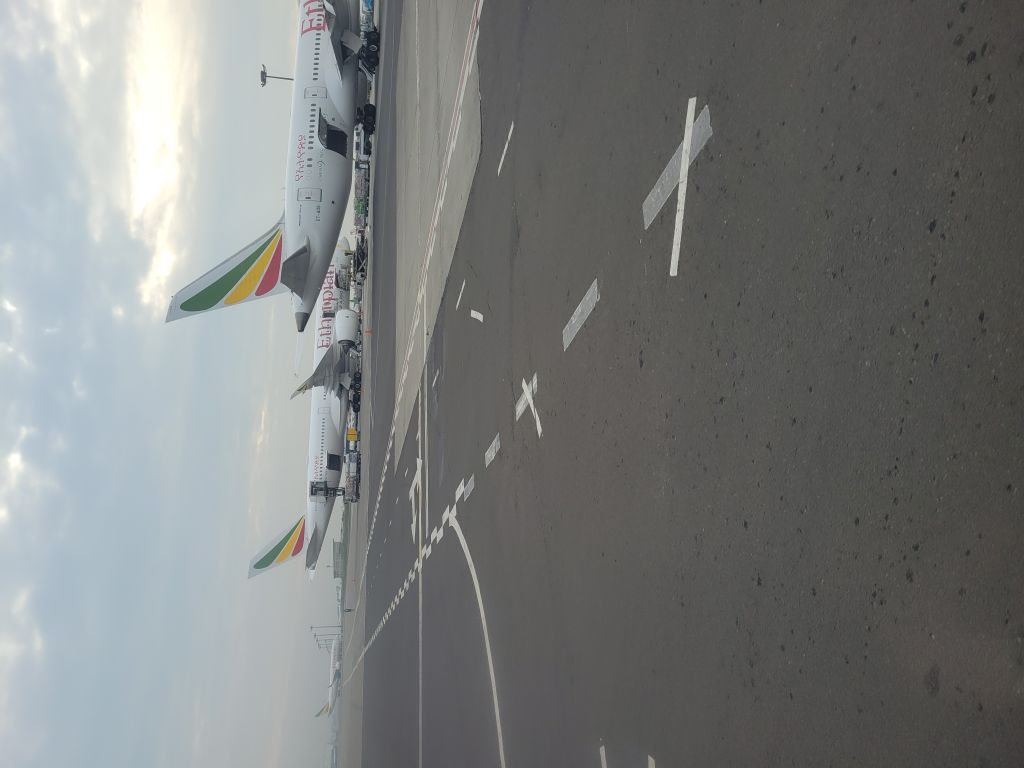 Airbus A350-900 — - Ethiopian  A350 parked next to Ethiopian 787 at Bole International Airport, Addis Abababr / Bus transfer from 767 Eth flight from Nairobi Jomo Kenyatta. Oct 3 2021 to Airport Terminal. 