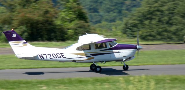 Cessna Centurion (N720GE) - Heading for a departure is this 1975 Cessna 210L Centurion in the Summer of 2023.