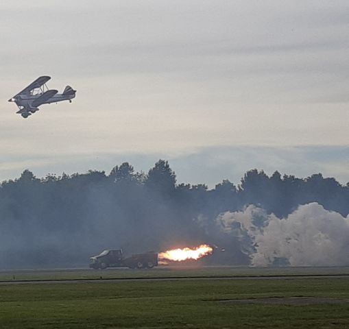 Boeing PT-17 Kaydet (N212PC) - Gary Rower buzzing Jerry in the Homewrecker Jet Truck.