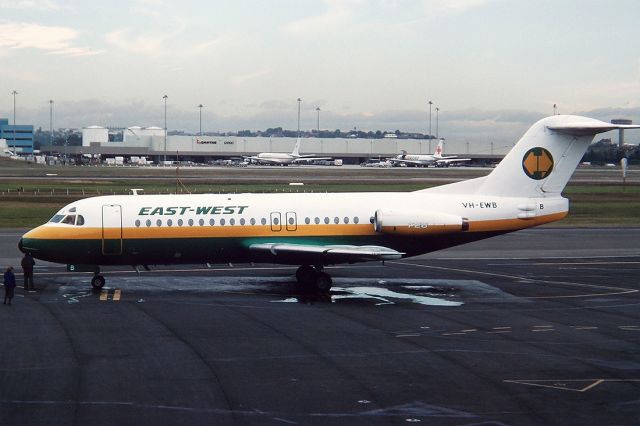 VH-EWB — - EAST WEST AIRLINES - FOKKER F-28-4000 : REG VH- EWB (CN 11205) - KINGSFORD SMITH SYDNEY NSW. AUSTRALIA - YSSY 28/6/1988 35MM SLIDE CONVERSION USING A LIGHTBOX AND A NIKON L810 DIGITAL CAMERA IN THE MACRO MODE.