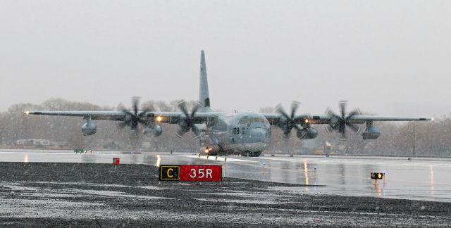 Lockheed C-130 Hercules (16-7108) - Lockheed KC-130J .... 167108br /USMC ... Call: "Raider One Two"br /Departing to PHNL (Honolulu, HI)br /br /The first of two USMC Hercs taxies on to Runway 35R as a cold front moves over the airport and changes what had been a steady overnight rain into the first moments of a steady all-day snowfall. Only a few minutes later, "Raider One Three" taxied up to this same position in a much, much heavier snowfall and about 60 minutes after the second Hercules departed the visibility at RNO dropped below minimums and seven inbound paxbirds had to divert to other airports. As a blizzard developed over the Truckee Meadows, nine other scheduled commercial pax arrivals were briefly ground-stopped at their point of origin and then all of those flights were completely cancelled when it became apparent that the snow storm was going to continue to cause below-minimums visibility for a few hours. No more commercial aircraft arrivals meant that in a short while there weren't going to be any commercial aircraft departures either so I went home when the falling snow became extremely heavy and visibility became so poor that I could not see the control tower or even the airport plows at my end of Runway 35R.