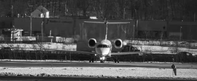 Embraer ERJ-145 (N11184) - Departing KPWM on a cold day