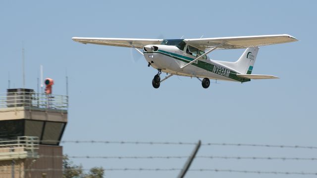 Cessna Skyhawk (N733AM) - This Skyhawk is jumping over the fence at Whiteman Airport in Pacoima, California, just a mile north of the Los Angeles city limits. This nice looking Cessna from the Glendale Community College made numerous take-offs and landings this morning.  