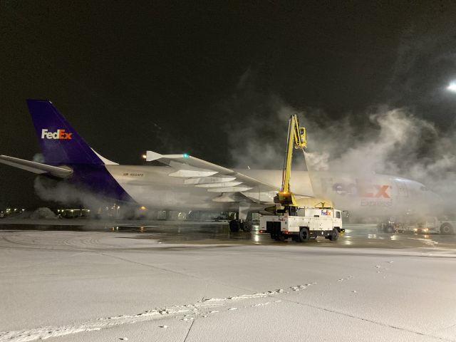 Airbus A300F4-600 (N654FE) - APU exhaust putting out a little steam after a little deicing fluid finds the exhaust.  br /A cold mid-winter night. 