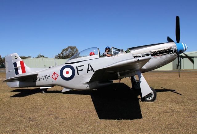 North American P-51 Mustang (VH-MFT) - Engine test run it may be - but the pilot is certainly happy to be in the seatbr /Recently fully overhauled Mustang looks brilliant in the low gloss finish - note the squadron badge on the tail