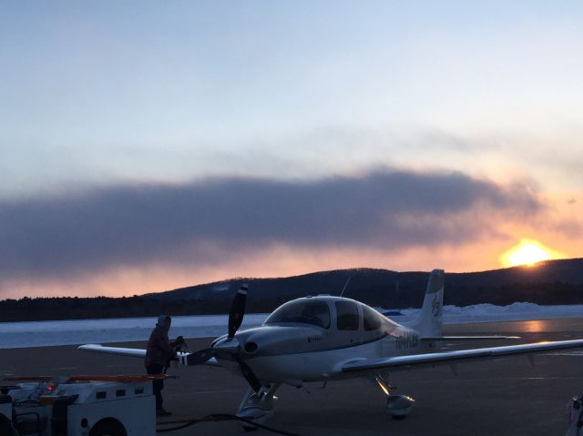 Cirrus SR-22 (N14KB) - John Chmiel of the Wausau Flying Service fueling Cirrus 14KB on a beautiful evening.