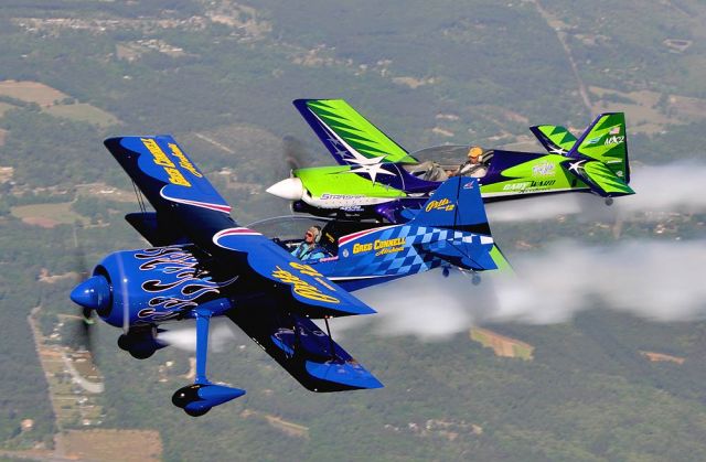 — — - Sunday Greg Connell Airshow "Pitts Model 12" and Gary Ward Airshow "MX2 Carbon Fiber" practiced formation flying. SMOKE ON... Photo credit Dean Wingard