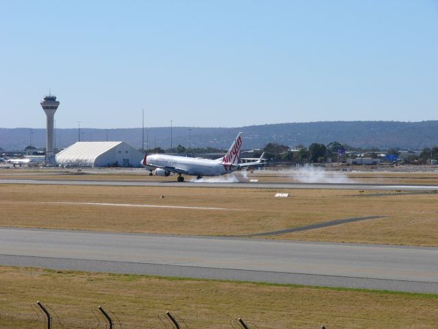 Boeing 737-800 (VH-YFW) - Virgin 737-800 landing at Perth captured from the public viewing deck