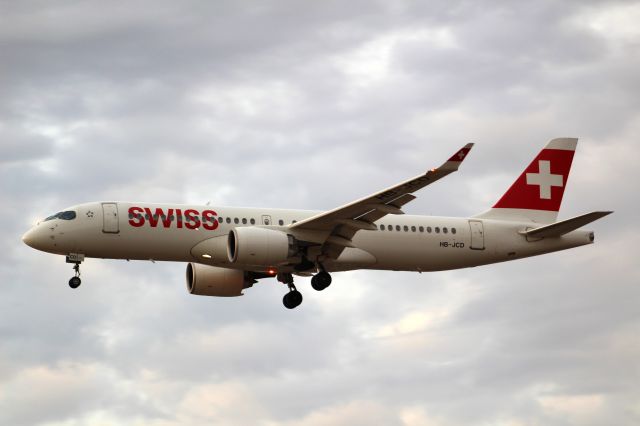 Airbus A220-300 (HB-JCD) - A Swiss A220-300 on final approach into LHR, Landing on runway 27L.br /br /Location: Myrtle Ave.br /Date: 04.08.22 (dd/mm/yy).