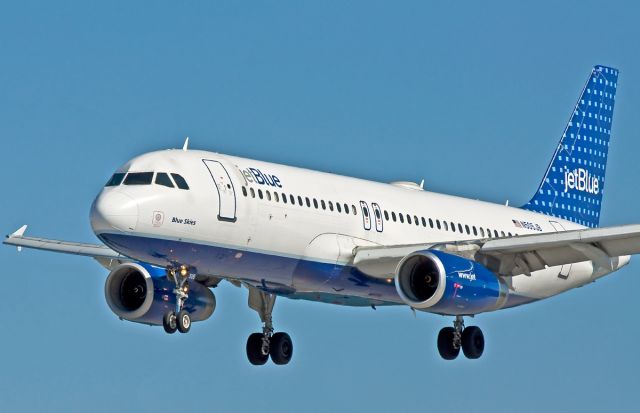 Airbus A320 (N505JB) - Super Close up landing shot of Blue Skies 