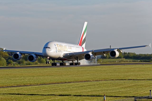 Airbus A380-800 (A6-EOR) - You get a fair amount of smoke from 20 tyres.  The evening flight, EK19, touches down at Manchester.