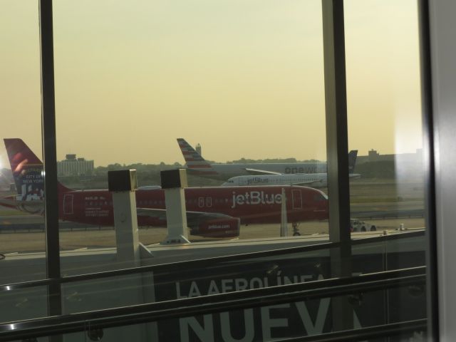 Airbus A320 (N615JB) - Here I am standing at T5 waiting for my flight to Savannah. I am watching the planes, and all of a sudden, I see the FDNY plane! I made perfect timing with this picture! Wasnt expecting anything as good as this.