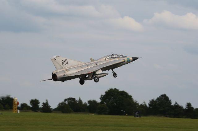 VALMET Draken (N810) - Saab J-35 Draken of the Swedish Air Force Historic Flight lifts of from the runway at R.A.F. Waddington.