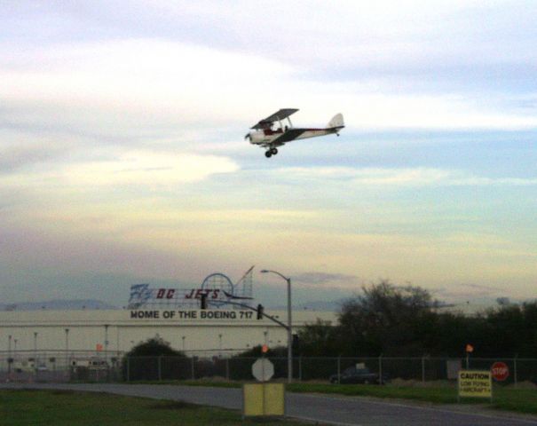 Lockheed C-130 Hercules (N5444) - Tiger Moth flown over Douglas Aircraft Factory at Long Beach, CA. by owner William N. Thibault in 2002.