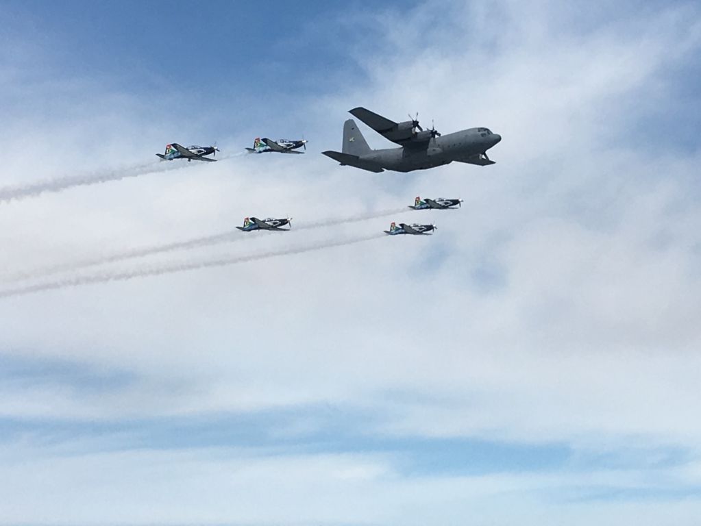 Lockheed C-130 Hercules — - SAAF C-130 in formation with Pilatus PC-7 trainers.br /Armed Forces Day fly-past over Table Bay, Cape Town