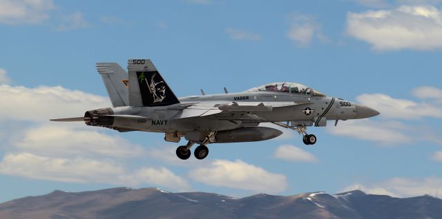 McDonnell Douglas FA-18 Hornet (16-6895) - United States Navy Boeing E/A-18G Growler (166895)br /United States Navy Reserves ----> VAQ 209 (Electronic Attack Squadron Two Oh Nine) "Star Warriors" CAG colorbirdbr /Call Sign: "Vader" {This aircraft was "Vader One One")br /Home Station: NAS Whidbey Island, WAbr /br /"Vader One One," the VAQ 209 Squadron's CAG Growler and the lead aircraft of a flight of four E/A-18Gs, is tucking the wheels into the wells as it climbs away from Runway 34R after a brief refueling stopover at Atlantic Aviation.br /br /** Special Note .... On the side of the nose gear door facing me, the words read ....br /JUNIOR SAILOR OF THE YEARbr /YN2 (AW) BRITTANY VOCEbr /RENO, NEVADAbr /br /Brittany, northern Nevada salutes you and congratulates you on your selection as Junior Sailor of the Year. **