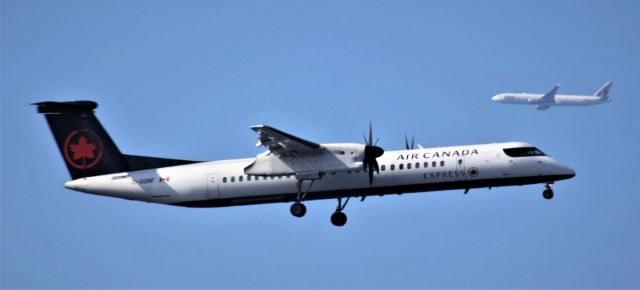 de Havilland Dash 8-400 (C-GGNF) - Air Canada about to land and QTR A7-BAF heading south to get in line for landing 9-30-2022