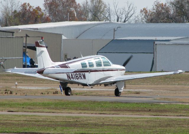 Beechcraft Bonanza (36) (N416RW) - Taxiing at Downtown Shreveport.
