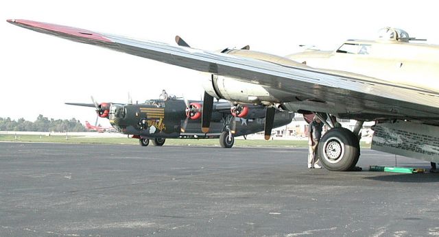 Consolidated B-24 Liberator (N224J) - Restored Consolidated B-24J (N224J), Witchcraft, taxis past 909, a restored B-17G (N93012) during a visit to a href=http://www.aviationky.org/The Aviation Museum of Kentucky/a. Both warbirds belong to the Collings Foundation.