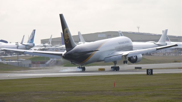 BOEING 767-300 (N348UP) - BOE279 makes tire smoke as it touches down on runway 16R on 2/23/12.