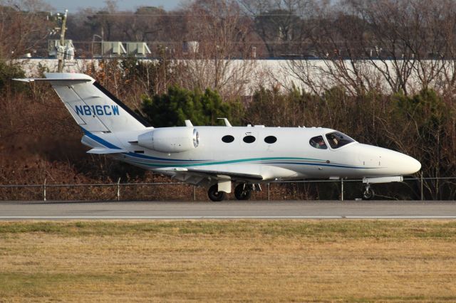 Cessna Citation Mustang (N816CW) - KORF (Norfolk International Airport) - 21 DEC 2013br /br /Snuff Mill Partners LLC 2008 Cessna 510 Citation Mustang N816CW from Wilmington New Castle Airport (KILG) rolling out on RWY 23 after landing.