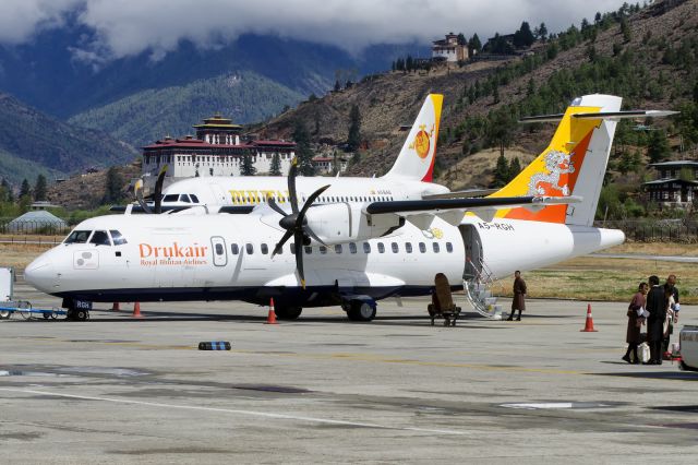 A5-RGH — - This aircraft often flies to regional destination like Zia International Airport in Dhaka, Bangladesh. Bhutans new airline "Bhutan Airlines" (A5-BAB) is seen being pushed back in the background.